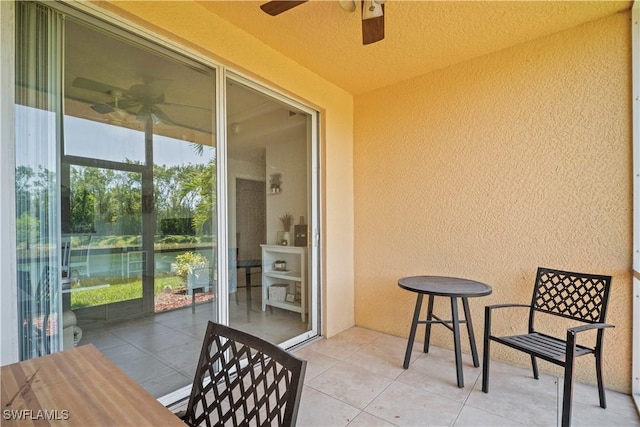 sunroom featuring ceiling fan