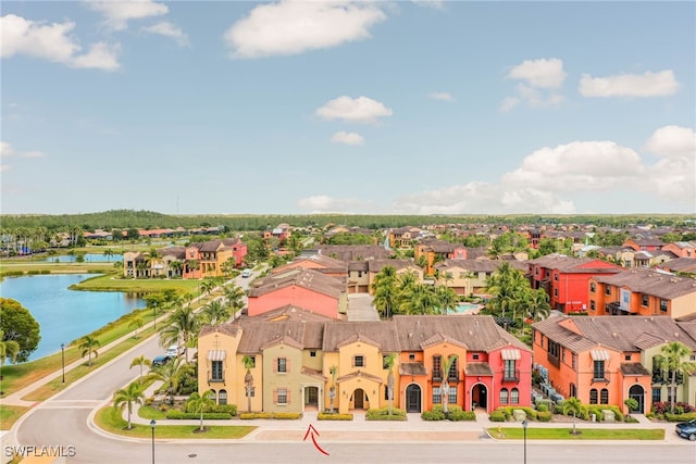 birds eye view of property featuring a water view and a residential view