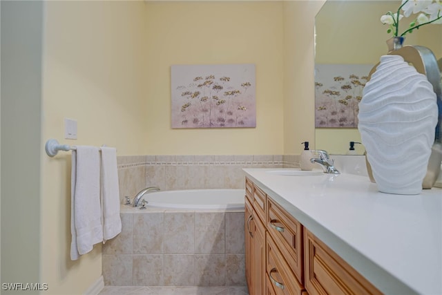 full bathroom with vanity, tile patterned flooring, and a bath