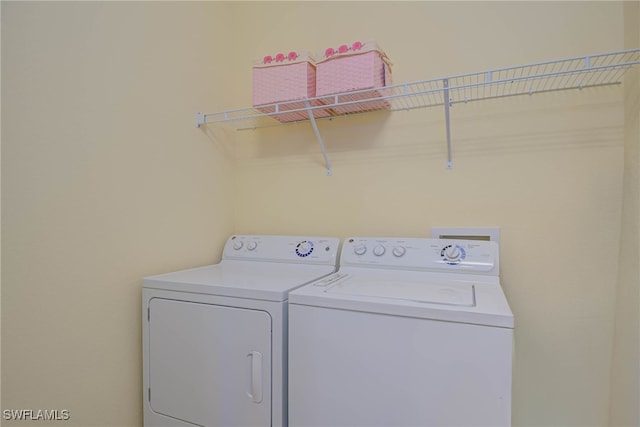 laundry area with separate washer and dryer and laundry area