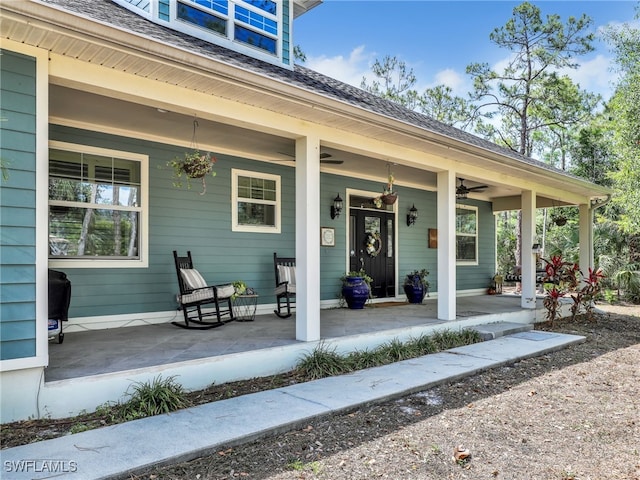 view of patio / terrace with ceiling fan and a porch