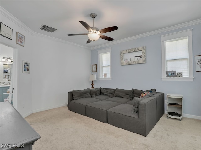 living area with visible vents, ornamental molding, ceiling fan, and carpet flooring