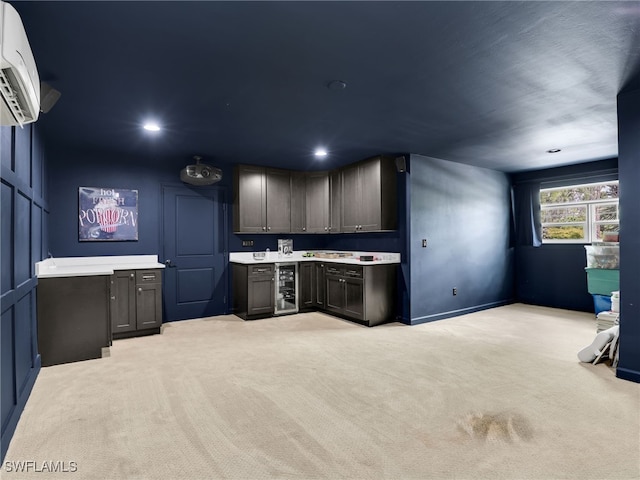 kitchen with light colored carpet, light countertops, an AC wall unit, and recessed lighting