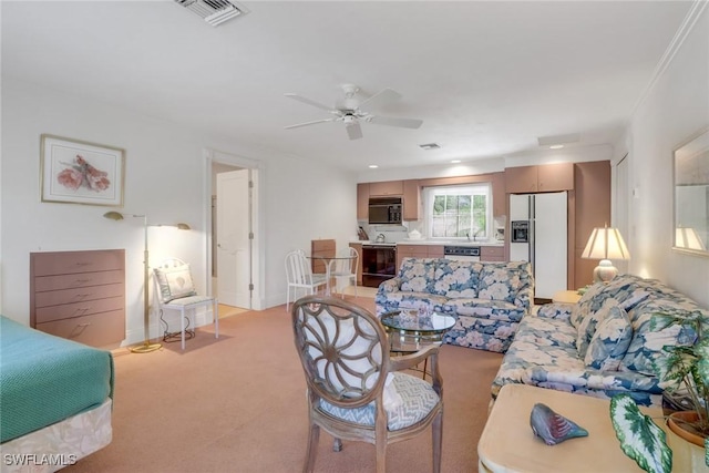 13488 Rosewood Ln, Naples, FL 34119 - living area with light colored carpet and ceiling fan
