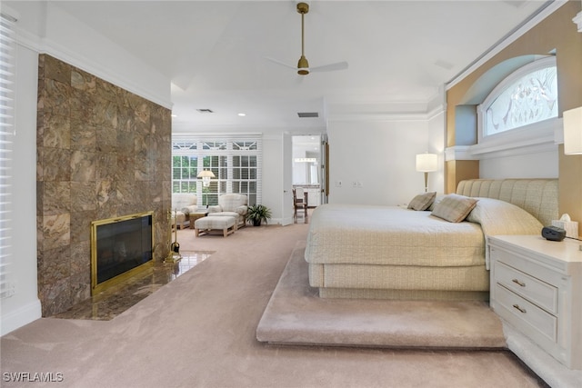 13488 Rosewood Ln, Naples, FL 34119 - bedroom featuring carpet, a fireplace, ornamental molding, and ceiling fan
