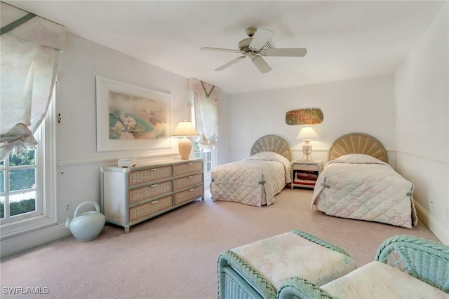 13488 Rosewood Ln, Naples, FL 34119 - carpeted bedroom featuring ceiling fan