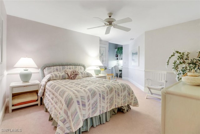 13488 Rosewood Ln, Naples, FL 34119 - bedroom featuring light colored carpet, ceiling fan, and baseboards