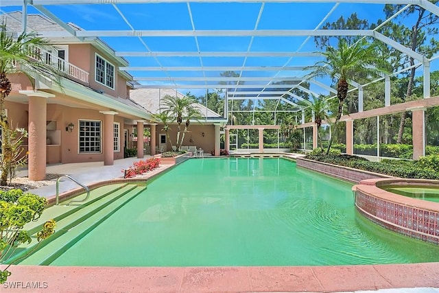 13488 Rosewood Ln, Naples, FL 34119 - view of pool featuring a patio, a pool with connected hot tub, and a lanai