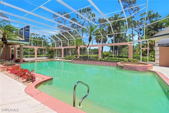 13488 Rosewood Ln, Naples, FL 34119 - view of pool featuring glass enclosure and a pool with connected hot tub