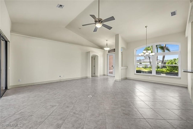 unfurnished living room with vaulted ceiling, tile patterned flooring, a chandelier, ceiling fan, and arched walkways