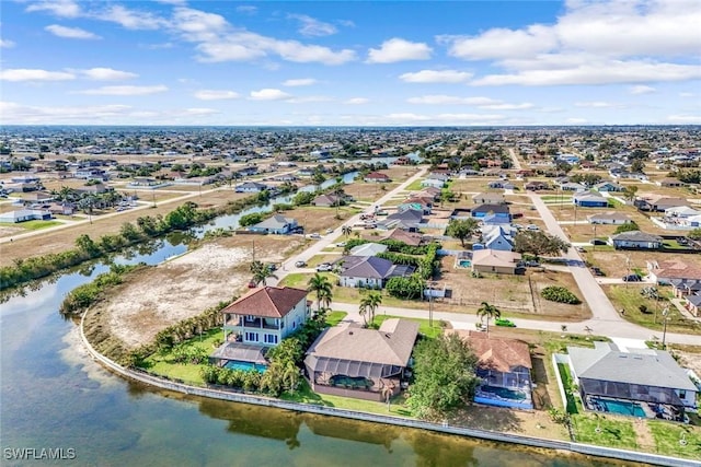 aerial perspective of suburban area featuring a nearby body of water