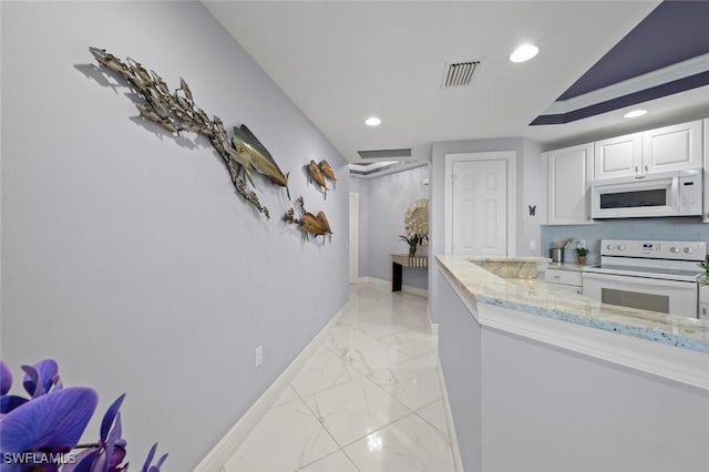 kitchen with light stone countertops, baseboards, marble finish floor, white appliances, and visible vents