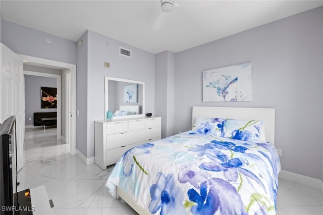 bedroom with baseboards, marble finish floor, and visible vents