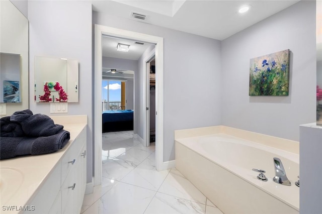 bathroom with marble finish floor, vanity, visible vents, connected bathroom, and a bath
