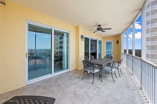 balcony with ceiling fan and outdoor dining space