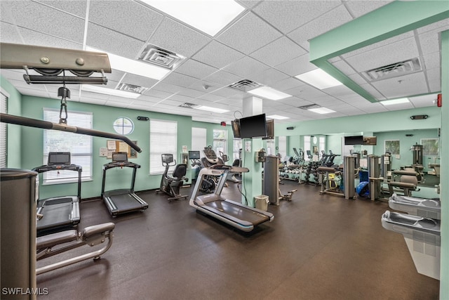 gym featuring a drop ceiling and visible vents