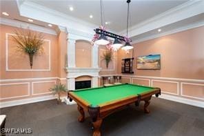 rec room with a fireplace, a decorative wall, billiards, ornamental molding, and recessed lighting