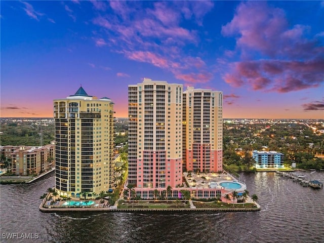 view of property featuring a water view and a view of city