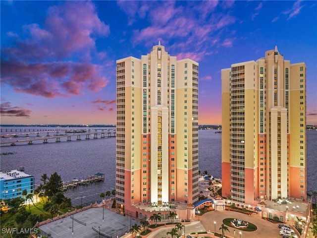 view of property with a city view and a water view
