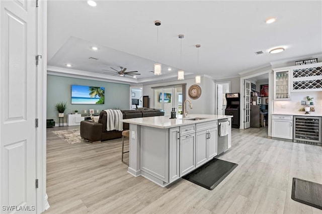 28140 Captiva Shell Loop, Bonita Springs, FL 34135 - kitchen featuring a sink, dishwasher, a ceiling fan, beverage cooler, and light wood-style floors