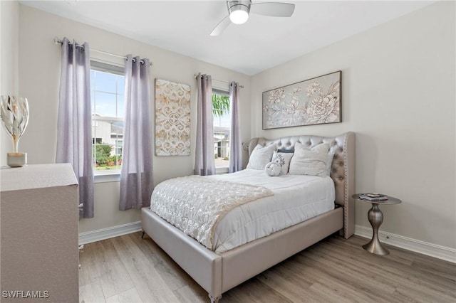 28140 Captiva Shell Loop, Bonita Springs, FL 34135 - bedroom with wood finished floors, baseboards, and ceiling fan