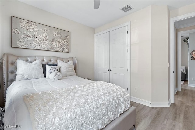 28140 Captiva Shell Loop, Bonita Springs, FL 34135 - bedroom featuring a ceiling fan, a closet, baseboards, visible vents, and wood finished floors