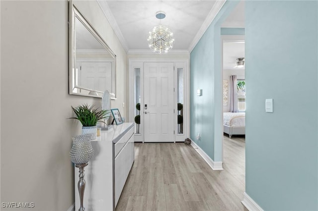 28140 Captiva Shell Loop, Bonita Springs, FL 34135 - foyer with baseboards, light wood-style floors, an inviting chandelier, and crown molding
