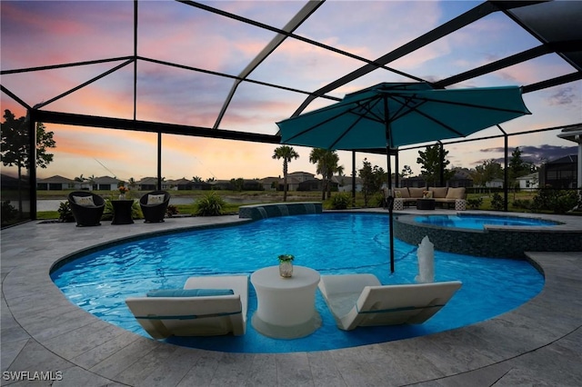 28140 Captiva Shell Loop, Bonita Springs, FL 34135 - view of swimming pool featuring a patio area, glass enclosure, outdoor lounge area, and a pool with connected hot tub