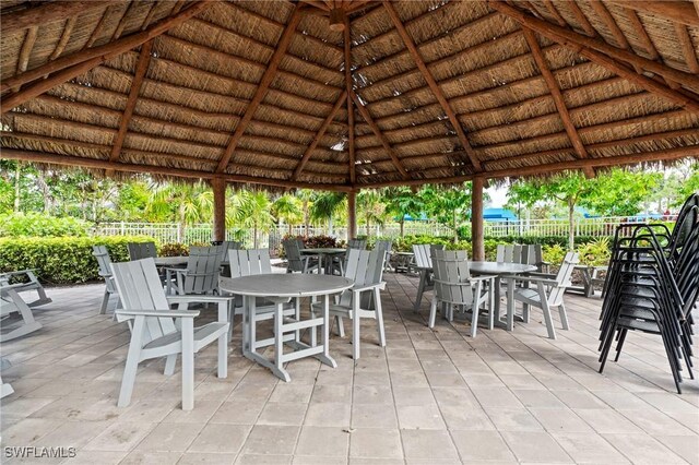 28140 Captiva Shell Loop, Bonita Springs, FL 34135 - view of patio featuring a gazebo, outdoor dining space, and fence
