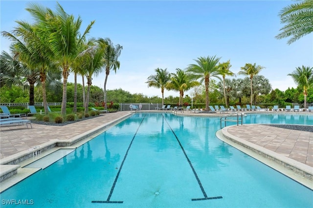 28140 Captiva Shell Loop, Bonita Springs, FL 34135 - community pool featuring a patio and fence