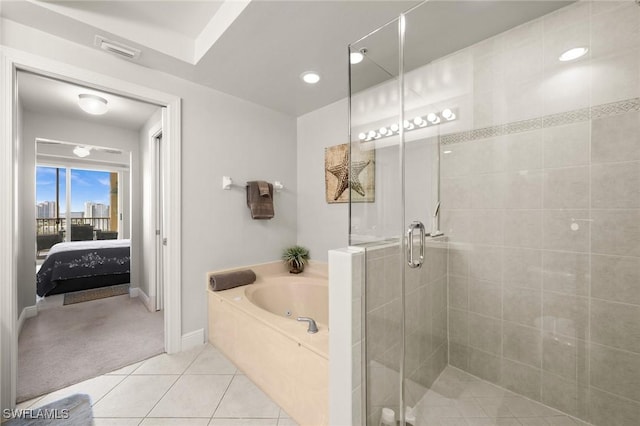 ensuite bathroom featuring a stall shower, baseboards, ensuite bathroom, tile patterned flooring, and a tub with jets