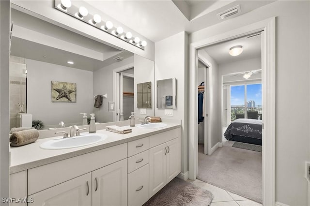 full bathroom with double vanity, visible vents, tile patterned flooring, and a sink