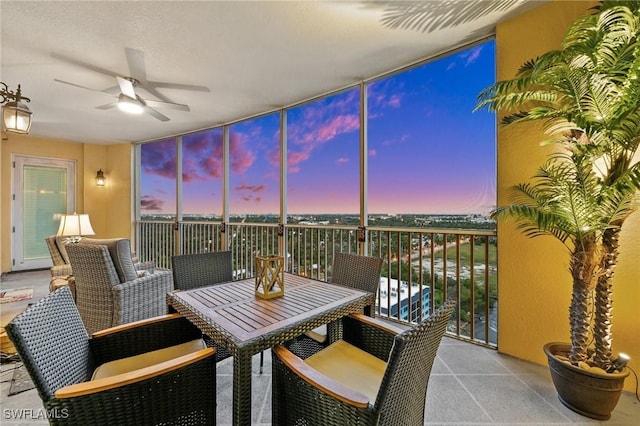 sunroom with ceiling fan