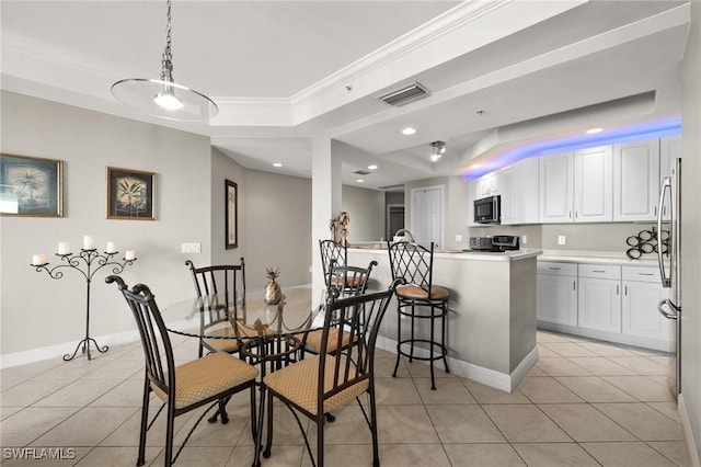 dining space featuring a raised ceiling, ornamental molding, visible vents, and light tile patterned flooring