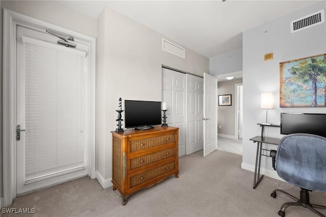 office with carpet floors, baseboards, and visible vents