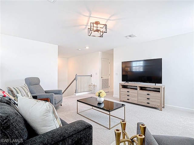 living room featuring visible vents, baseboards, and carpet floors