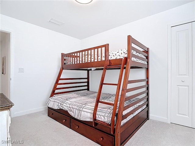 bedroom with baseboards, carpet flooring, and visible vents