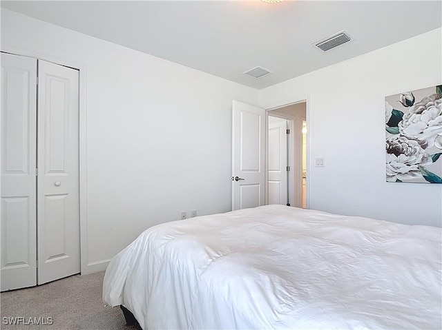 carpeted bedroom with visible vents