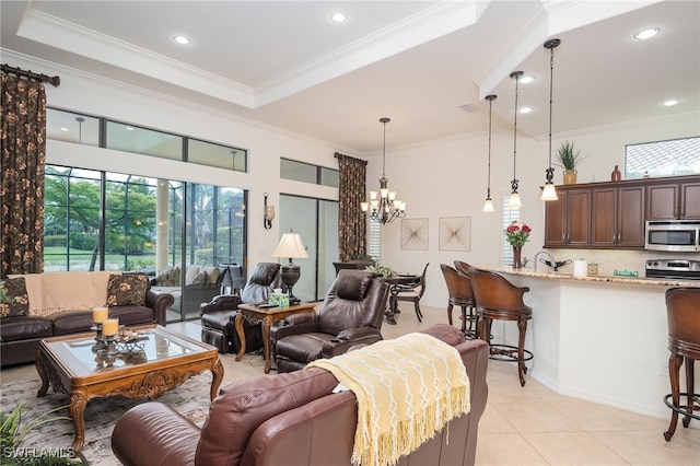 living room with ornamental molding, a wealth of natural light, a notable chandelier, and light tile patterned flooring