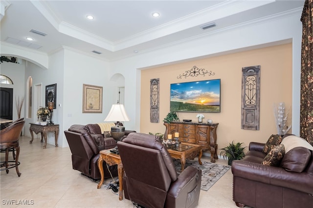 living area with arched walkways, recessed lighting, ornamental molding, and visible vents