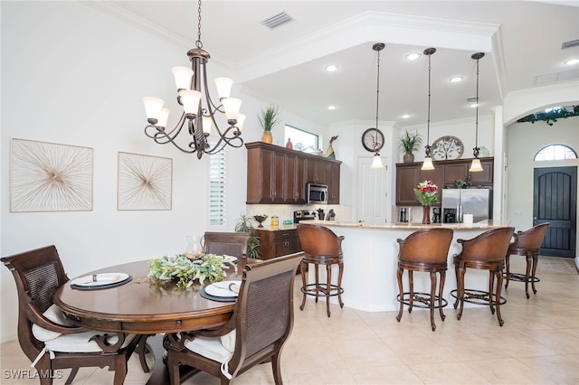 dining area with a wealth of natural light, ornamental molding, a chandelier, and visible vents
