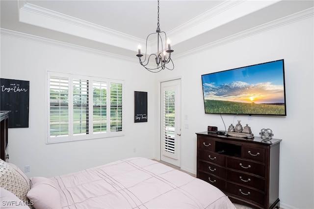 bedroom featuring crown molding, access to exterior, a raised ceiling, and an inviting chandelier