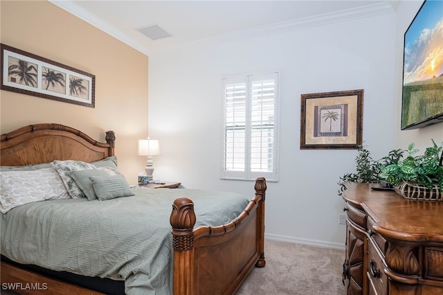 bedroom featuring baseboards, ornamental molding, visible vents, and carpet floors