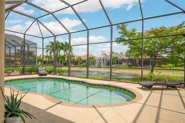 outdoor pool with a patio area and a lanai