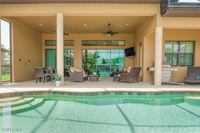 pool with area for grilling, outdoor lounge area, a patio, and ceiling fan