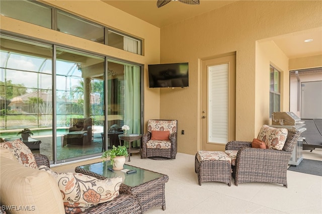 exterior space with a sunroom, carpet, and a textured wall