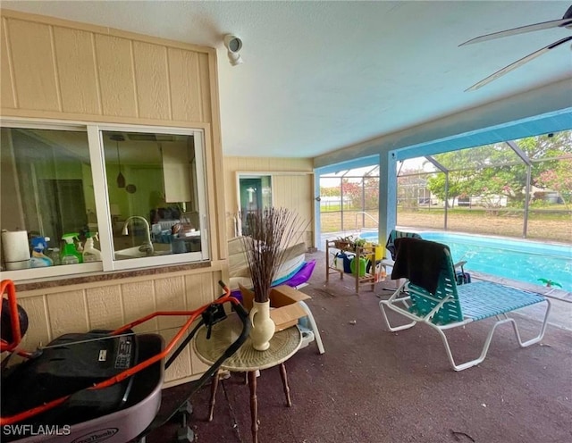 view of patio featuring an outdoor pool and a lanai