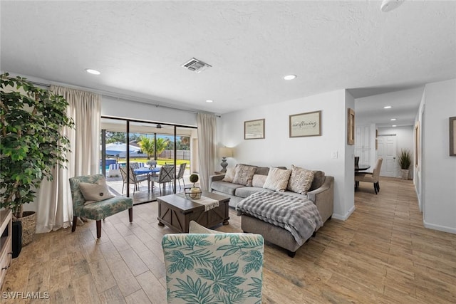 2080 39th St SW, Naples, FL 34117 - living area with light wood finished floors and recessed lighting
