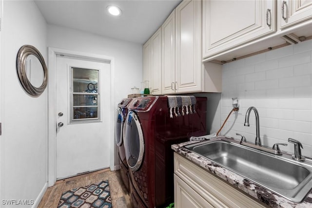 2080 39th St SW, Naples, FL 34117 - laundry room featuring washing machine and clothes dryer, light wood-type flooring, cabinet space, recessed lighting, and baseboards