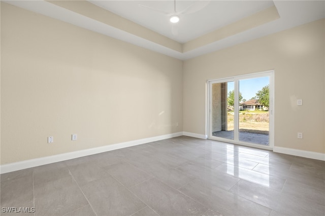 1043 Albert Ave, Lehigh Acres, FL 33971 - empty room featuring baseboards, a raised ceiling, and ceiling fan